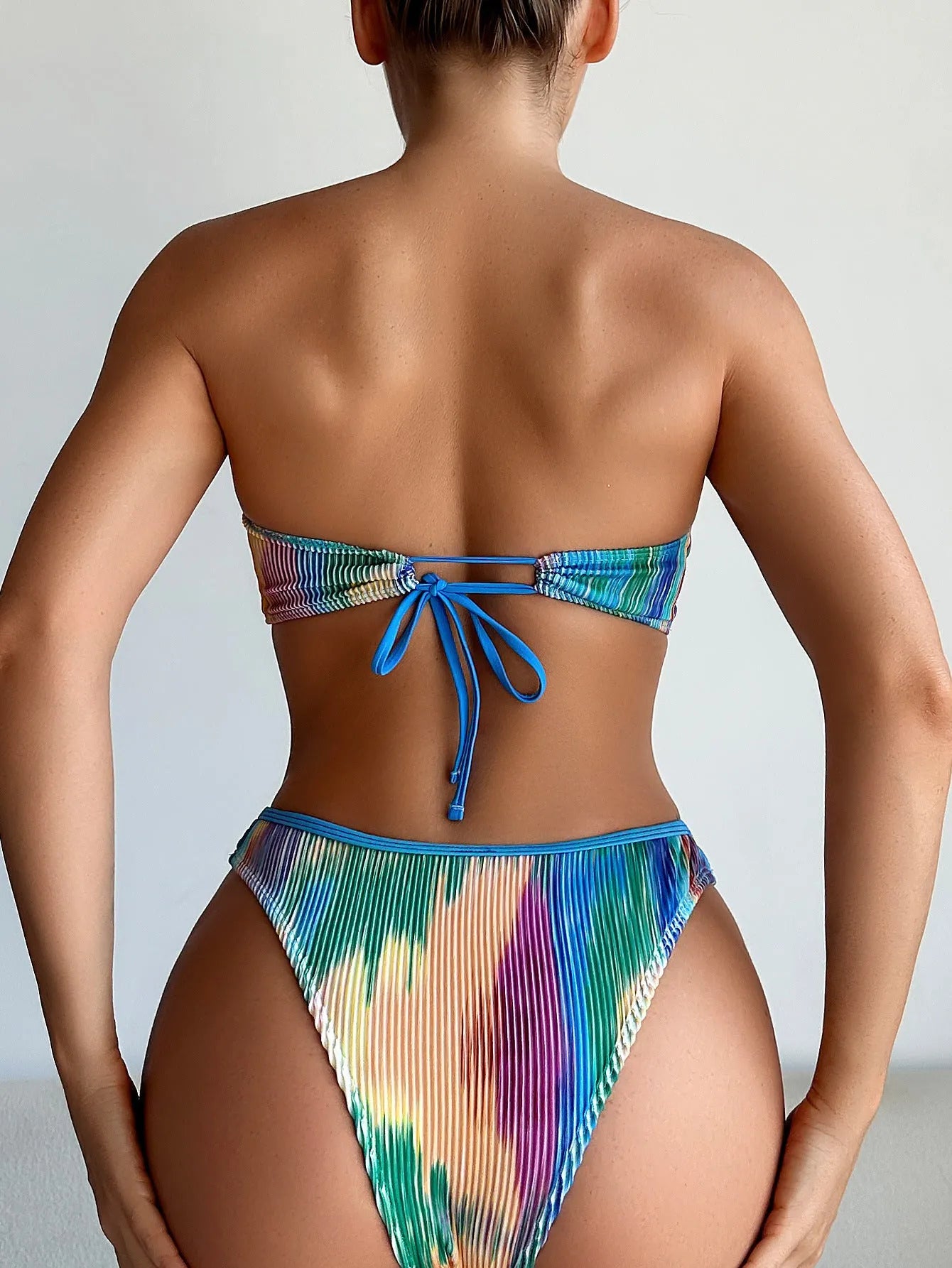 Printed tube top and briefs bikini set on a mannequin, shown in a solid colour.