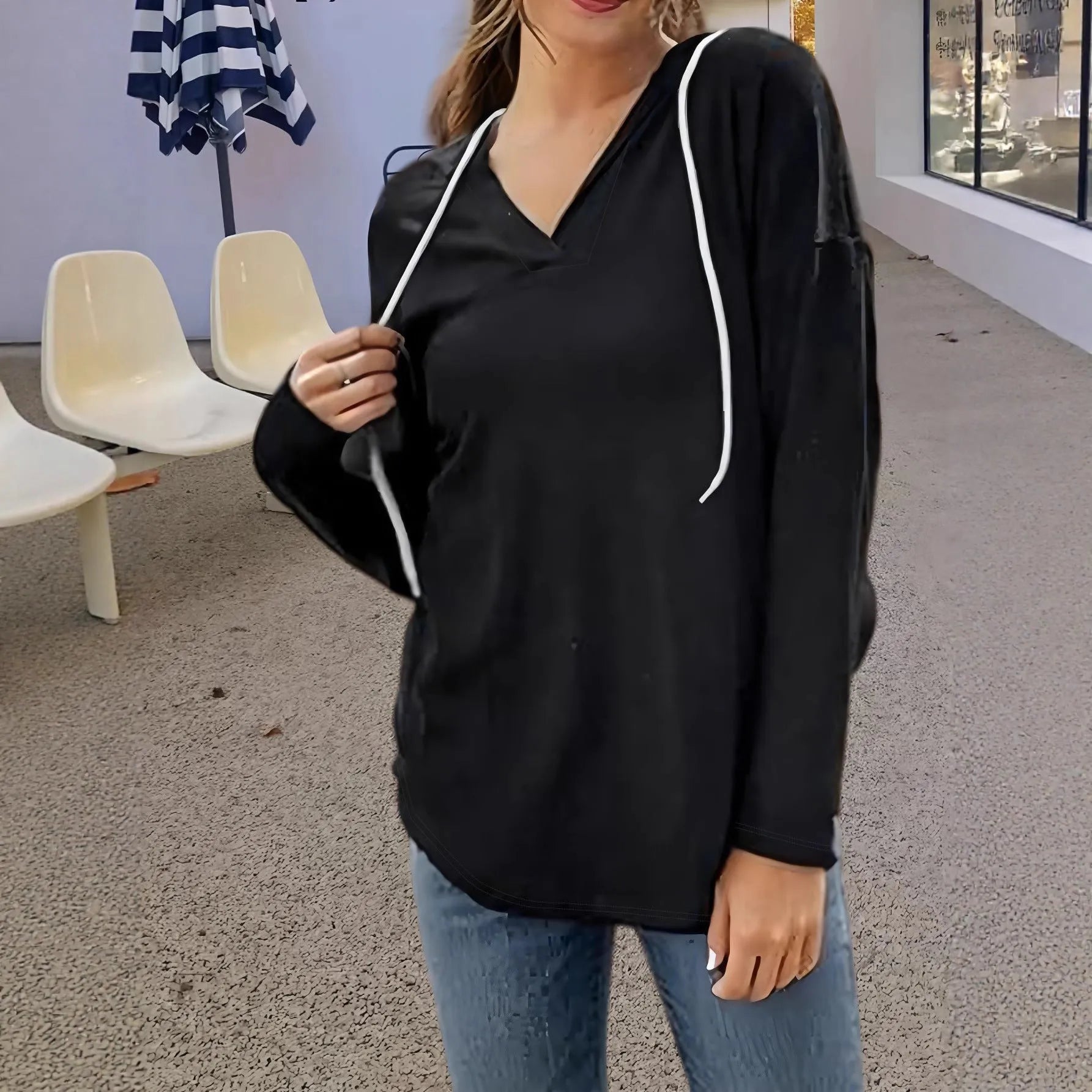 Women's red V-neck hooded sweatshirt with long sleeves on a hanger.