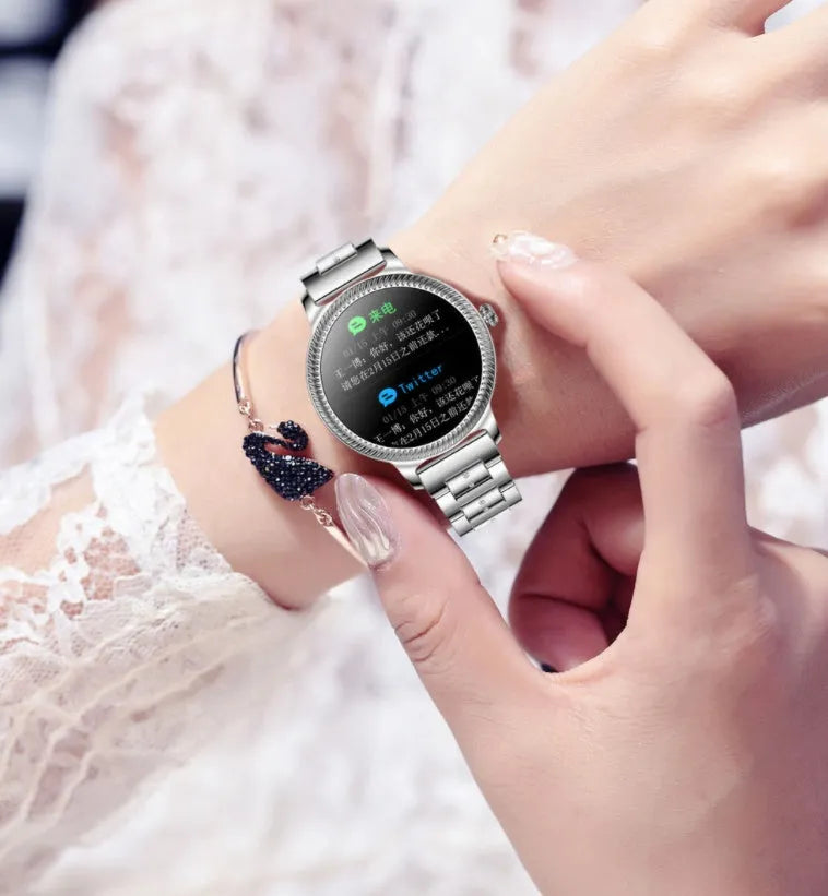 AK38 ladies smart watch with stainless steel wristband on wrist showing 1.09-inch screen