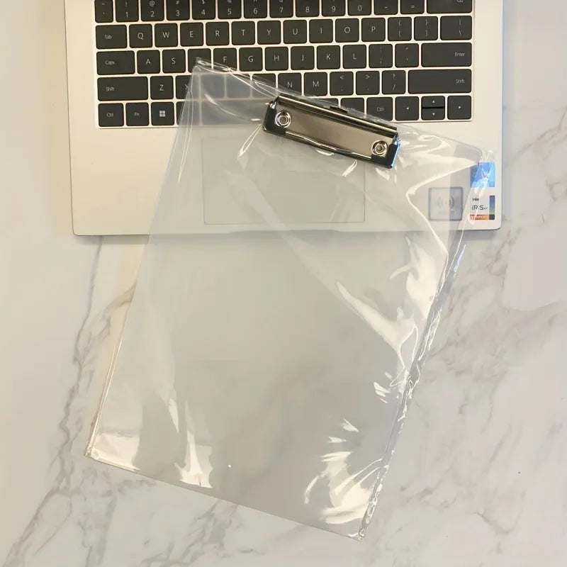 Transparent A4 plate writing board holder with metal clip, shown in blue colour on a desk.