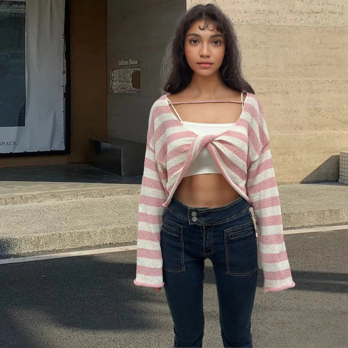 Striped long-sleeved pullover sweater in mercerised cotton, shown in blue with an exposed navel design.