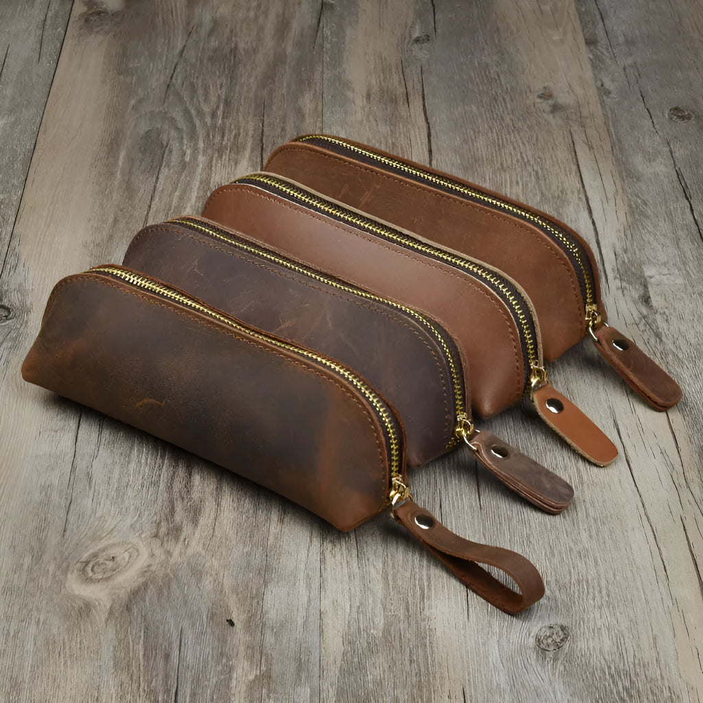 Square leather pencil case with zip closure in black colour showing 18cm dimensions