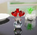 Handcrafted geometric rose ornament made from coloured K9 crystal glass on a neutral background.