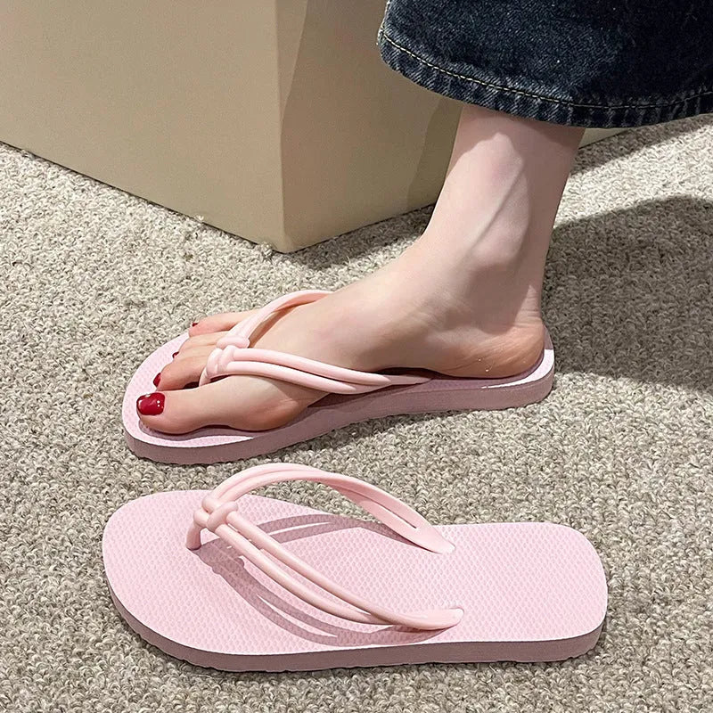 Men's PVC toe-covering flip flops in beige colour on a plain background.