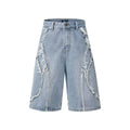 Distressed raw edge denim shorts in a straight leg cropped cut, shown in light blue colour.