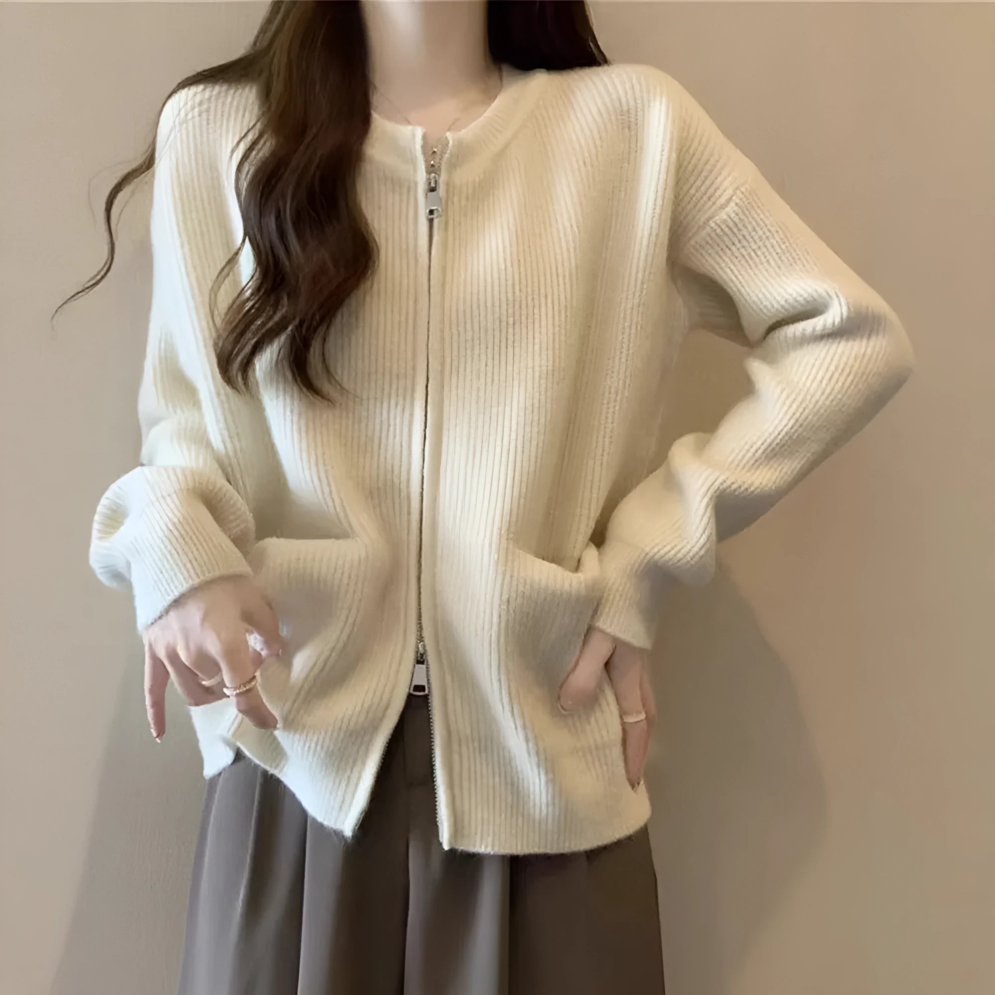Women's soft sweater coat in temperature-sensitive fabric showing beige colour option with long sleeves and cardigan styling