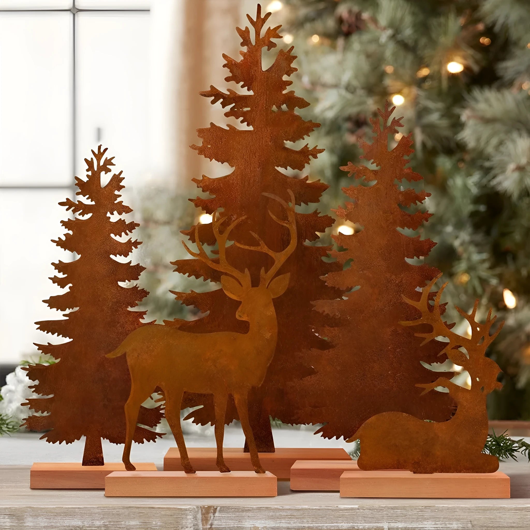Set of three rusty iron Christmas tree ornaments on a wooden surface