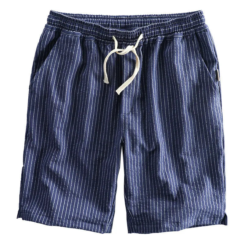 Men's striped casual shorts with elastic waistband in turmeric colour showing loose straight cut