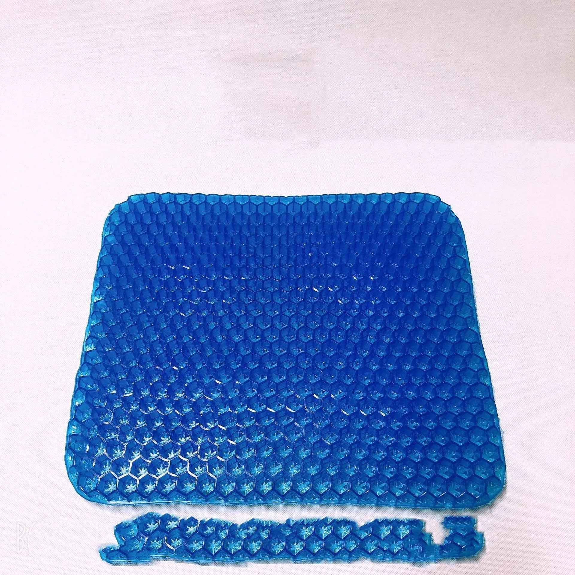 Blue breathable honeycomb gel seat cushion with double-thick construction showing removable cover