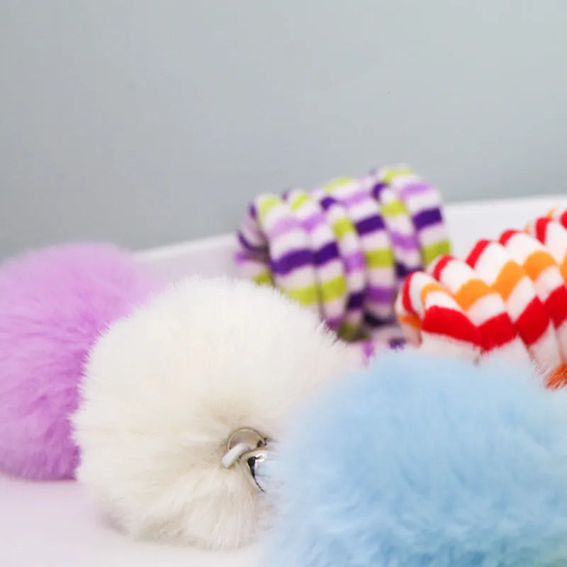 Hanging cat toy set with suction cup, colourful inflatable ball, and bell stick for kitten play.