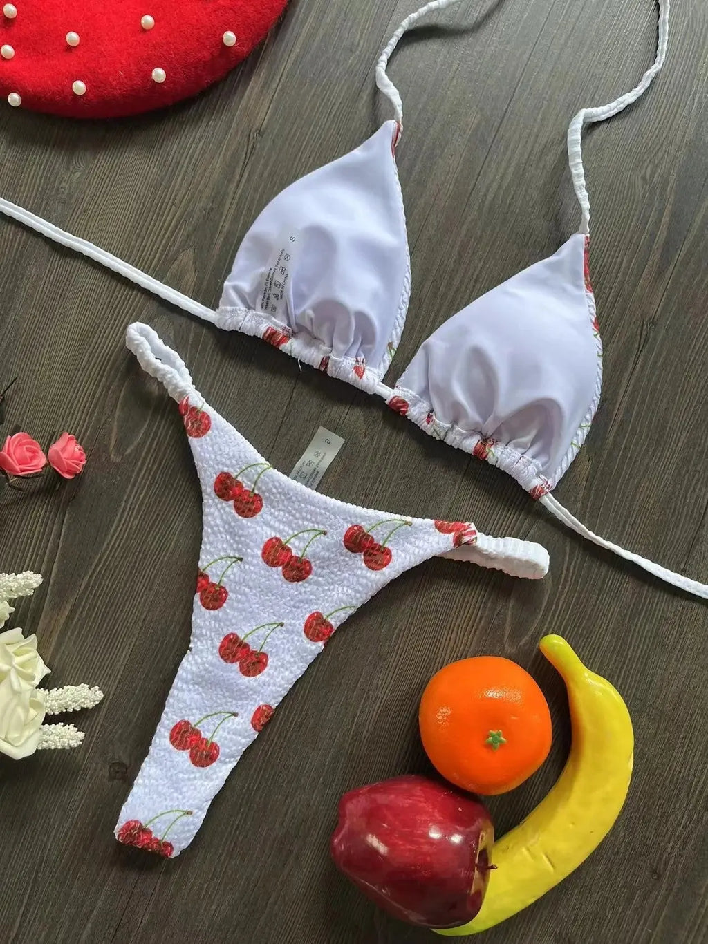 Women's briefs-style bikini swimsuit in a printed pattern, made from nylon with a cotton lining.