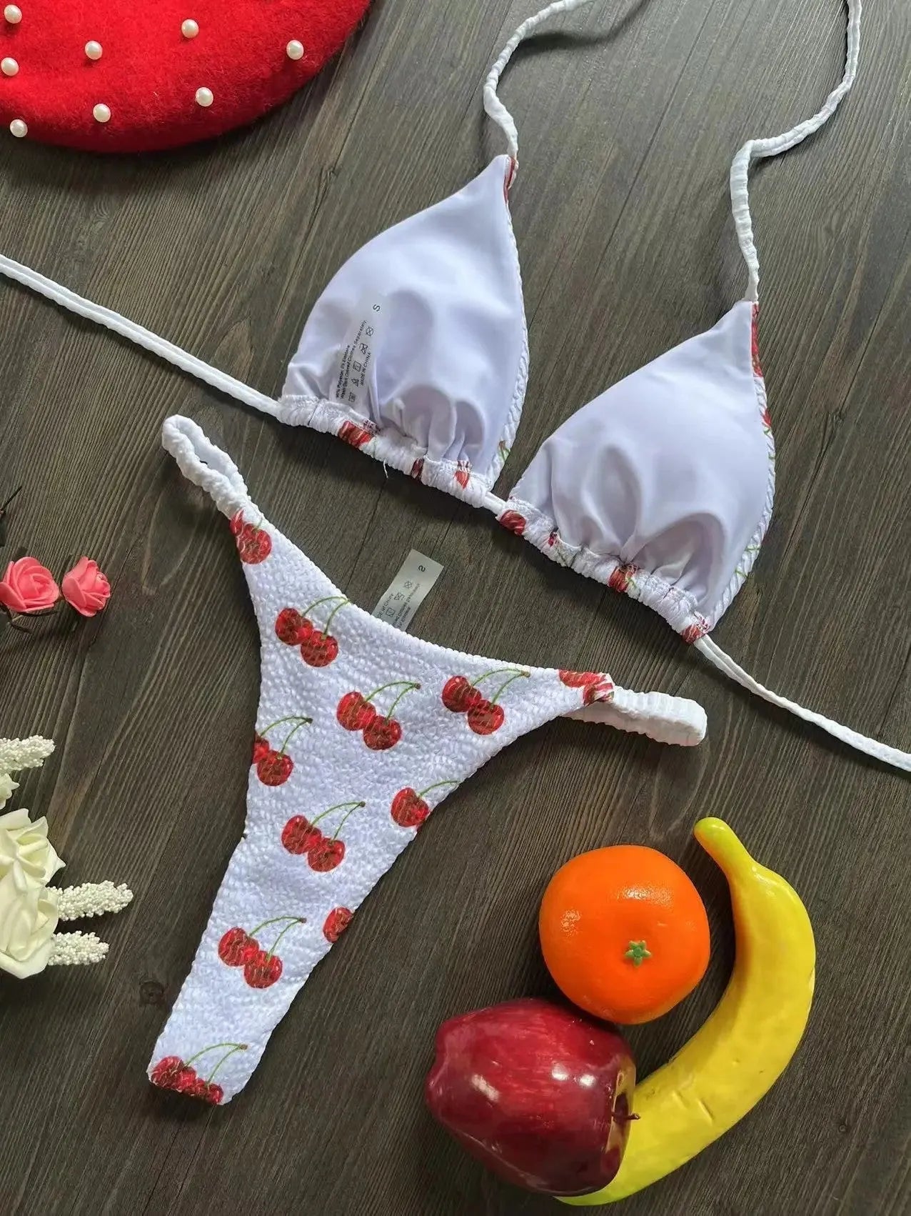 Women's briefs-style bikini swimsuit in a printed pattern, made from nylon with a cotton lining.