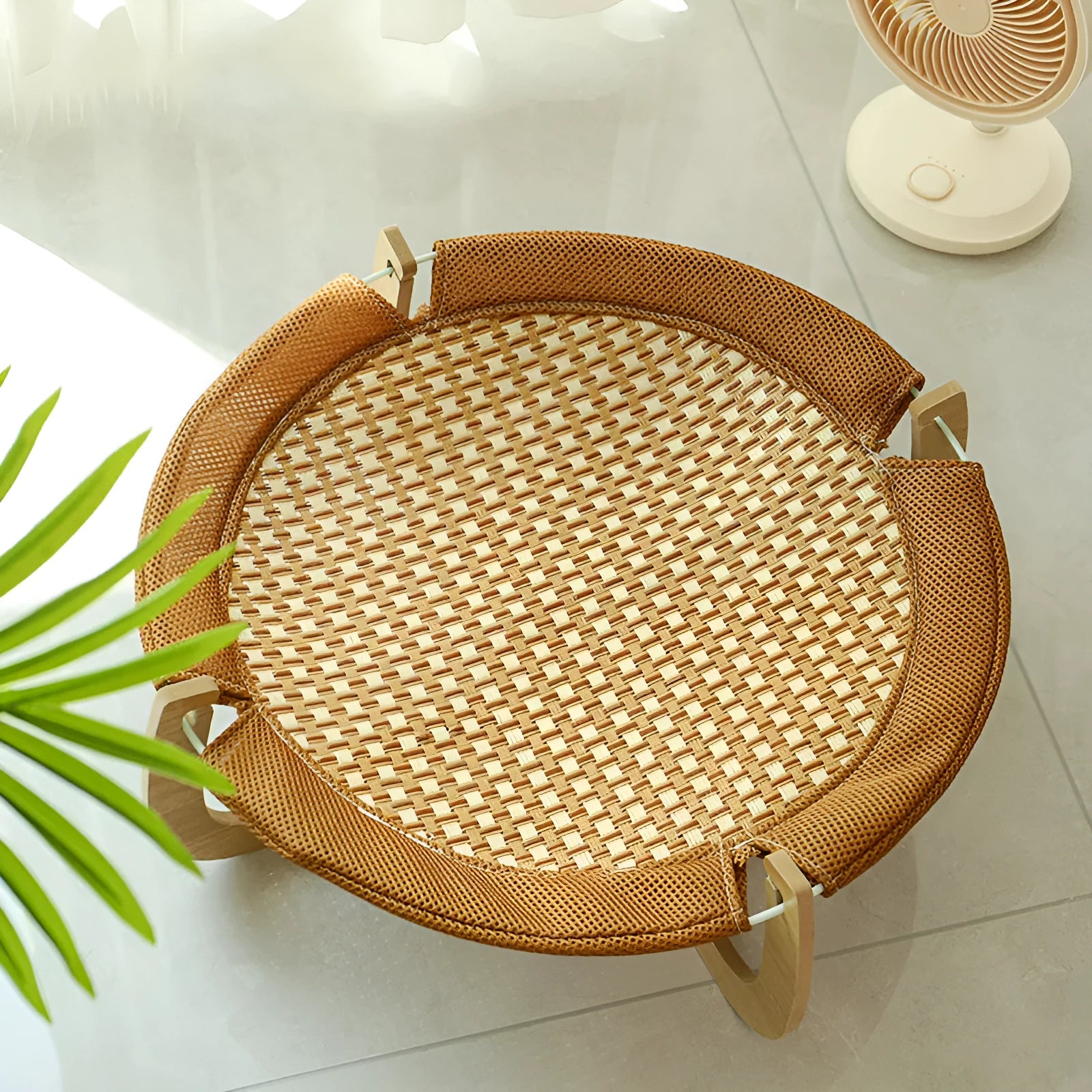 Brown woven rattan pet hammock bed measuring 46cm square with off-ground design