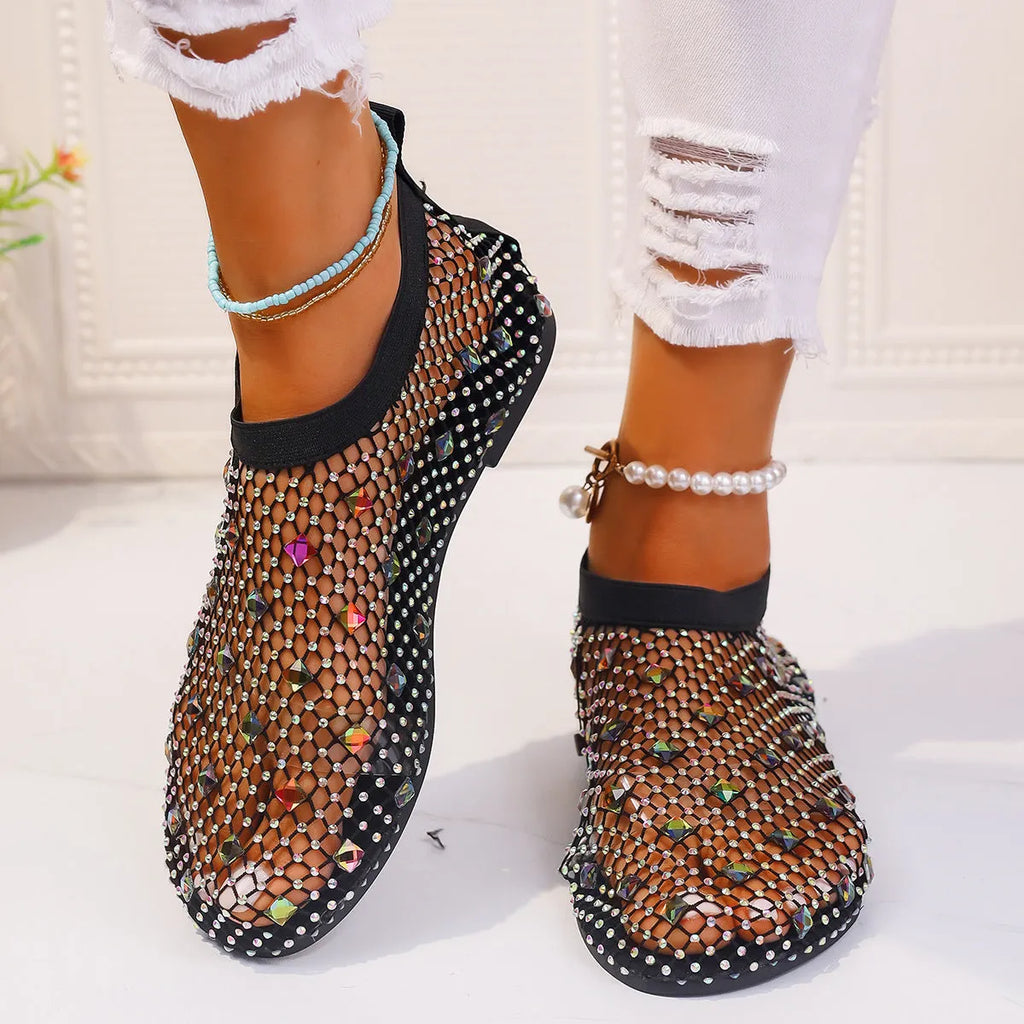 Women's flat mesh sandals with colourful rhinestone decoration on the upper and a round toe.