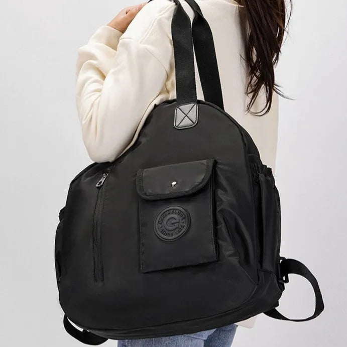 Large nylon backpack in black colour showing sandwich pocket design and dimensions
