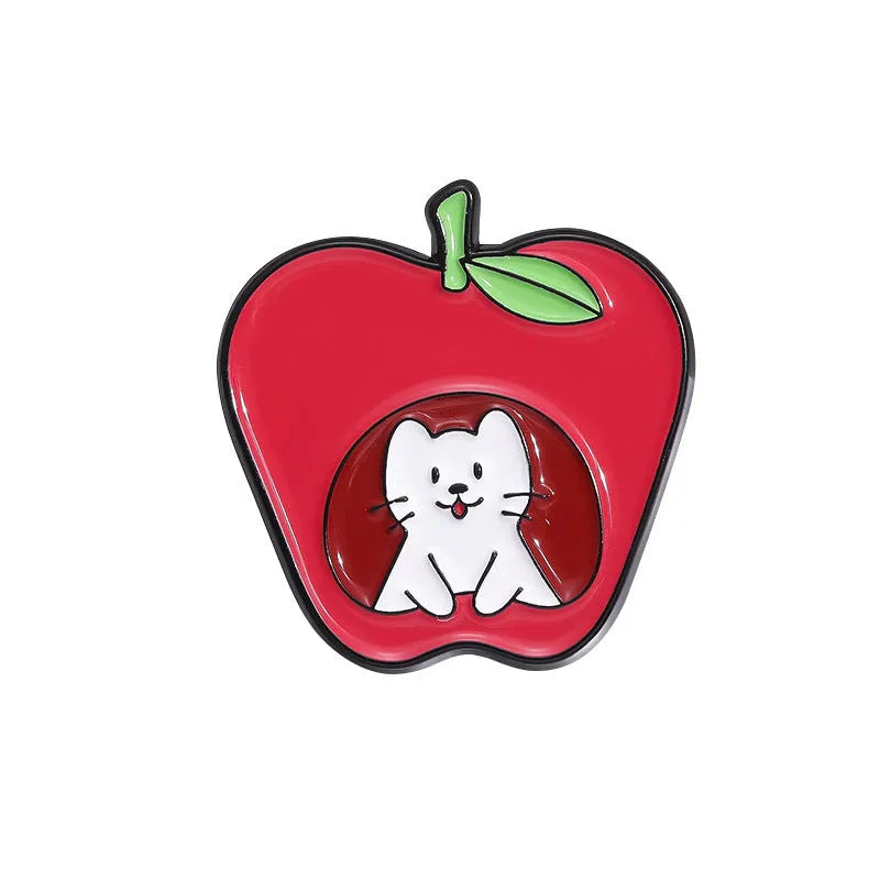 Colourful cartoon fruit design zinc alloy brooch pin on a fabric background.