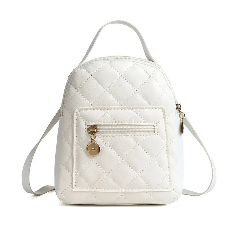 Hardback white PU girls backpack with embroidery, showing front sandwich pocket and soft carry handle.