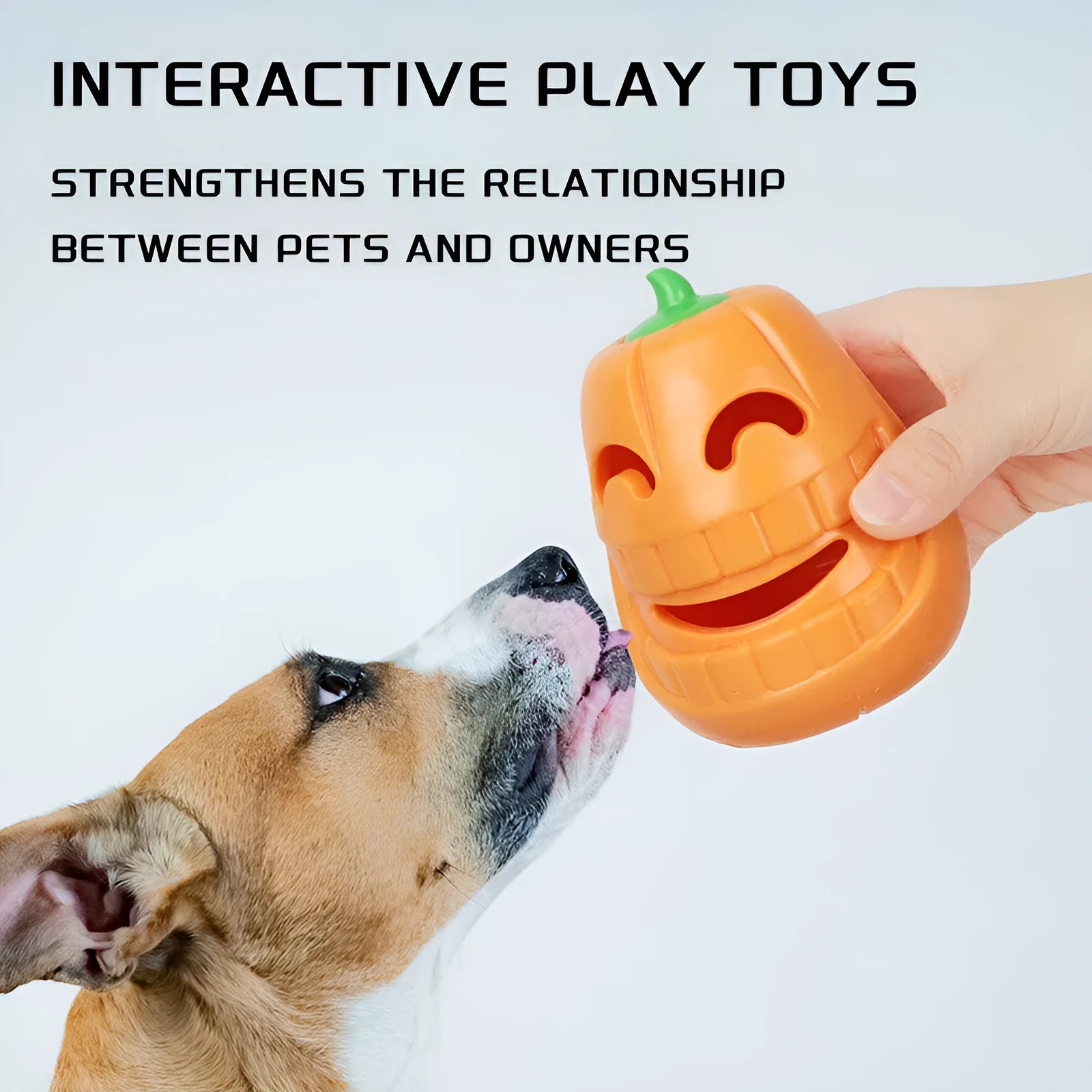 Orange Halloween pumpkin shaped dog chew toy made of durable rubber with a treat-dispensing funnel.