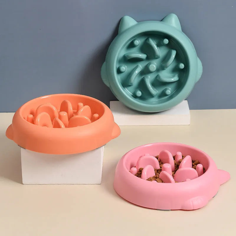 Green bone-shaped slow feeder bowl for dogs and cats with interior ridges