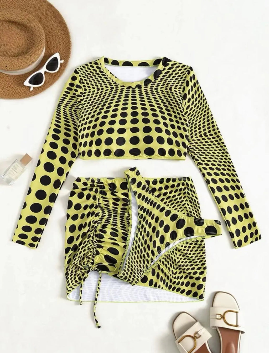Women's green polka dot swimsuit three-piece set showing top, skirt, and bra components