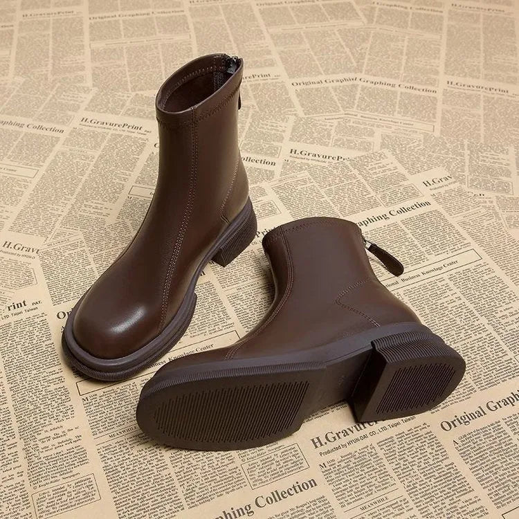 Women's black ankle boots with thick flat heel, round toe and back zipper closure