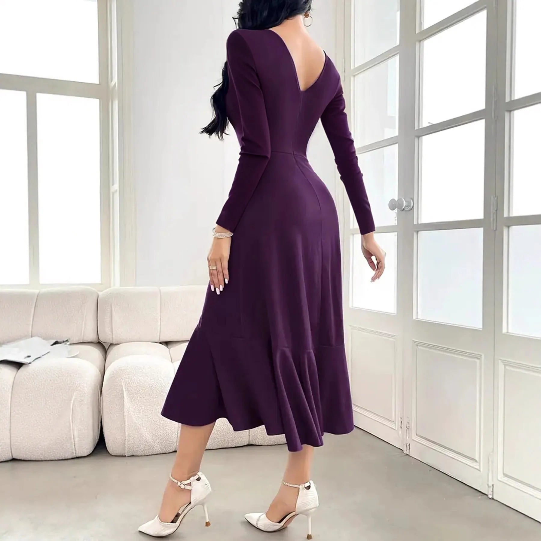 Purple women's dress with long sleeves, ruffle detailing, and mid-waist design