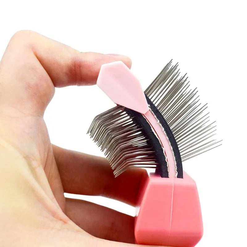 Blue double-sided dog grooming brush with stainless steel pins and ergonomic non-slip handle on a white background.
