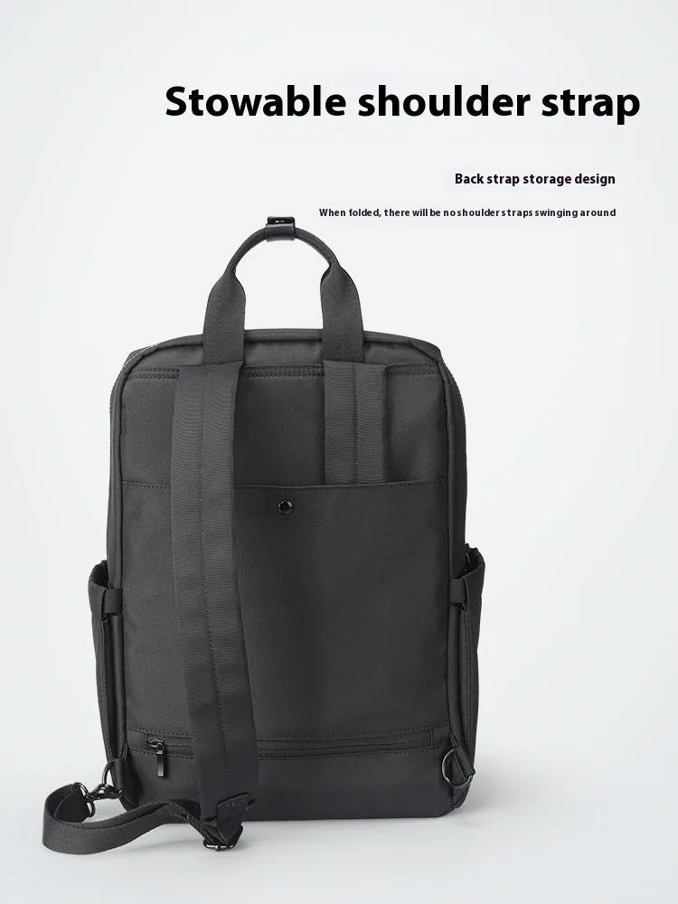 Elegant black Oxford cloth computer backpack showing main compartment and straps