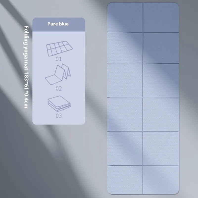 Blue folding portable TPE gymnastic mat unfolded on a wooden floor