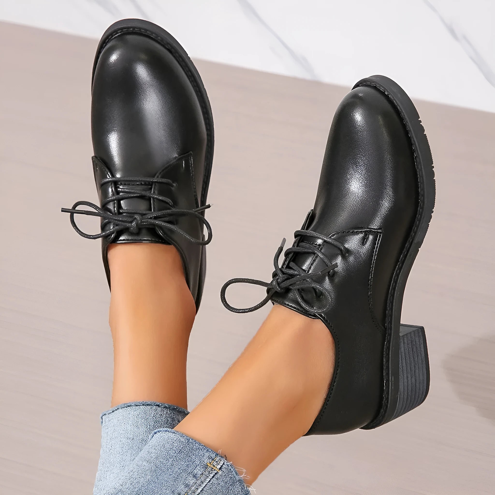 Black women's leather work shoes with thick chunky heel and pointed toe