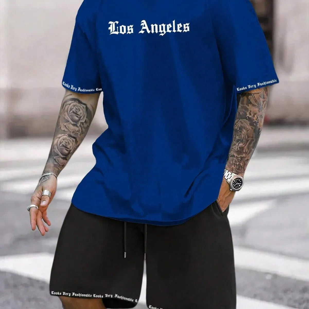 Sports-style short sleeve shirt and matching shorts set in a printed pattern, shown in colour G23P1573.