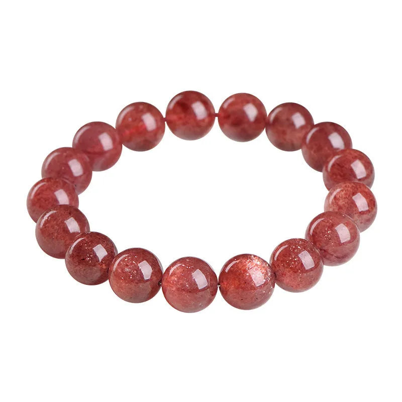 Natural cherry red strawberry quartz bracelet with geometry-shaped beads on a wrist.