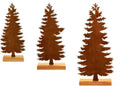 Set of three rusty iron Christmas tree ornaments on a wooden surface