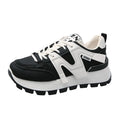 Women's low-top unisex sneaker in black or white with artificial PU upper and rubber sole
