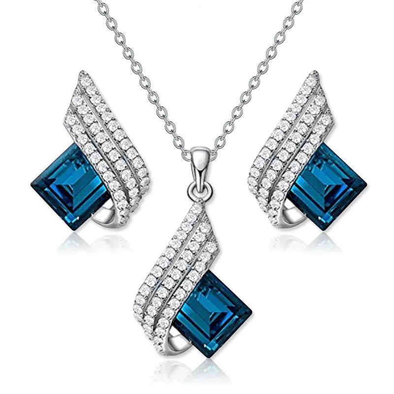 Women's necklace and ear stud set with alloy pendant, cross chain, and glass detailing in electroplated finish