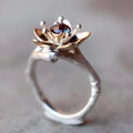 Silver two-tone alloy ring with geometric floral design on a finger, showing sizes 5 to 11.
