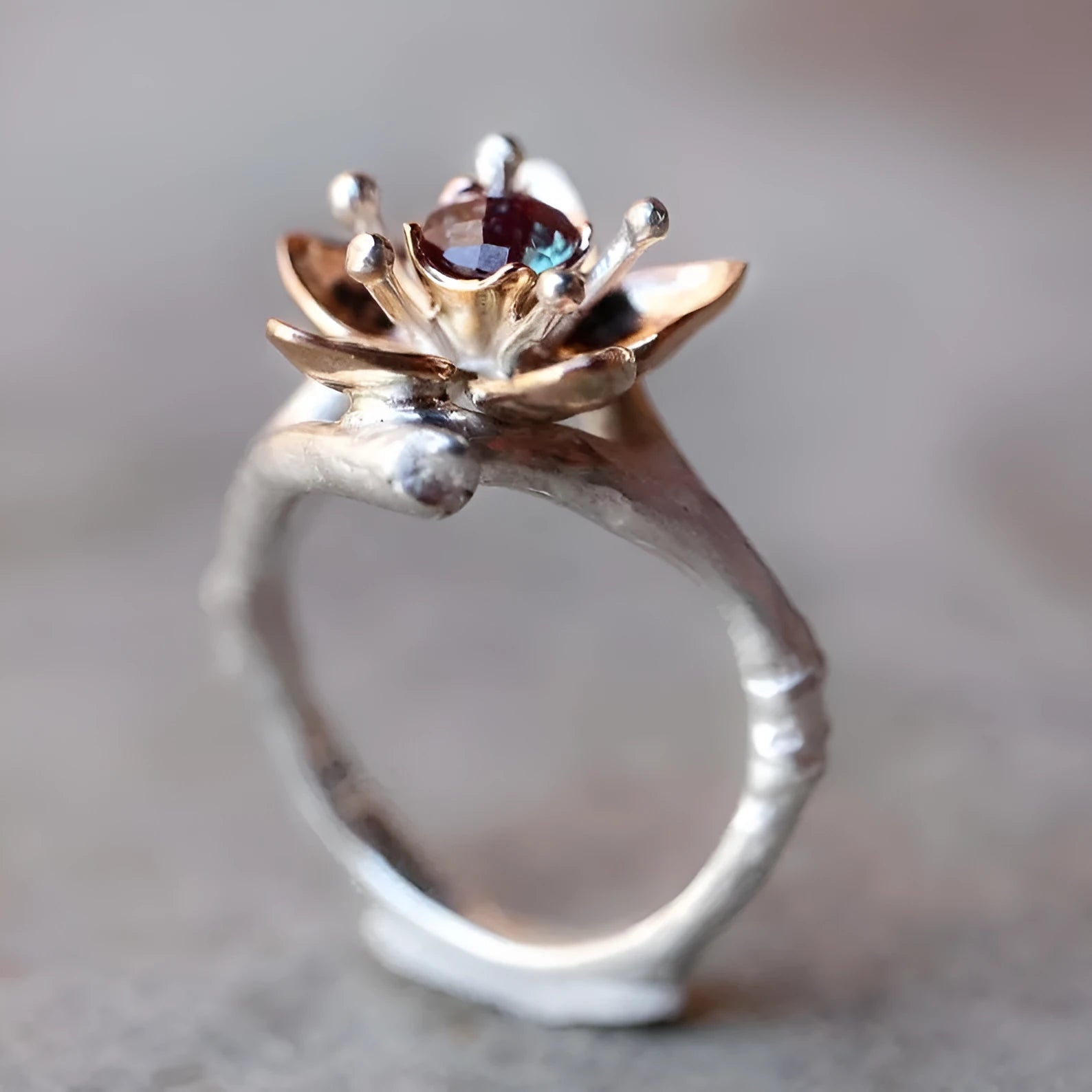 Silver two-tone alloy ring with geometric floral design on a finger, showing sizes 5 to 11.