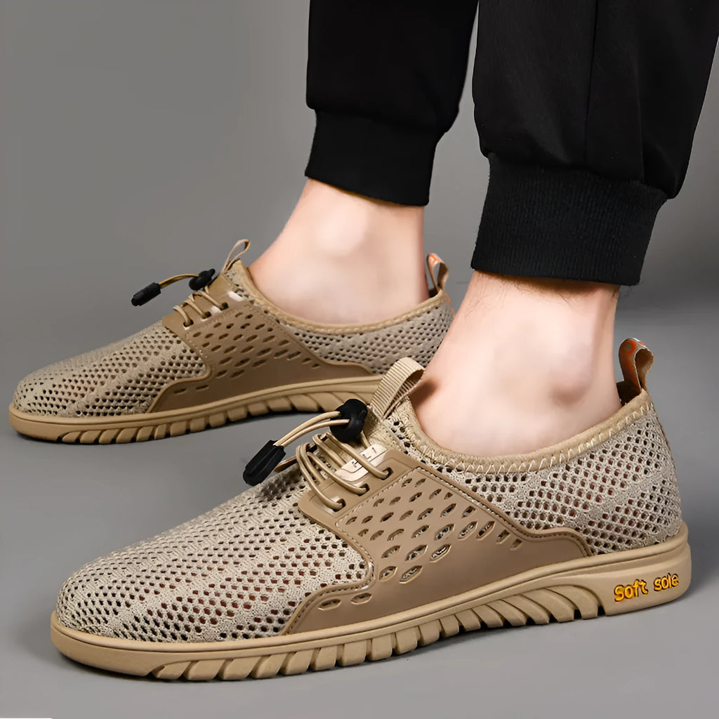 Men's black casual shoes with breathable mesh upper and elastic band closure on a white background.