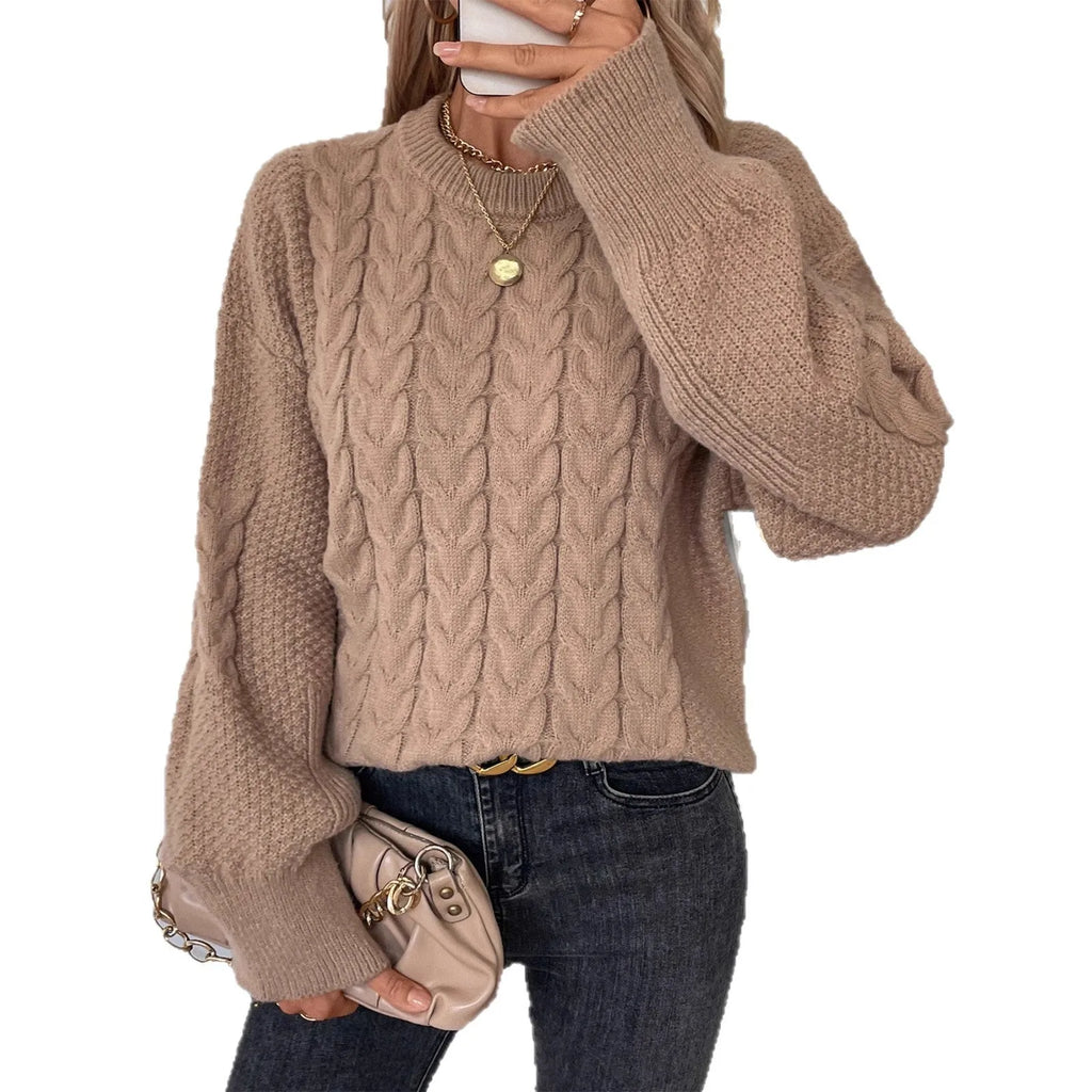 Women's beige loose pullover sweater with round neck and regular sleeves on hanger