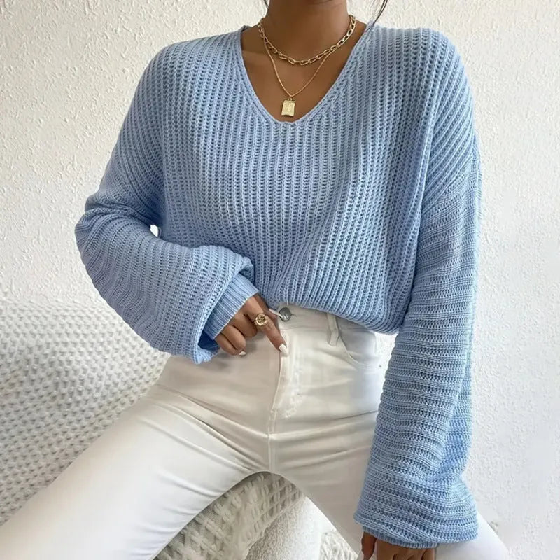 Women's solid colour long sleeve pullover in loose casual fit, shown in available colour options.