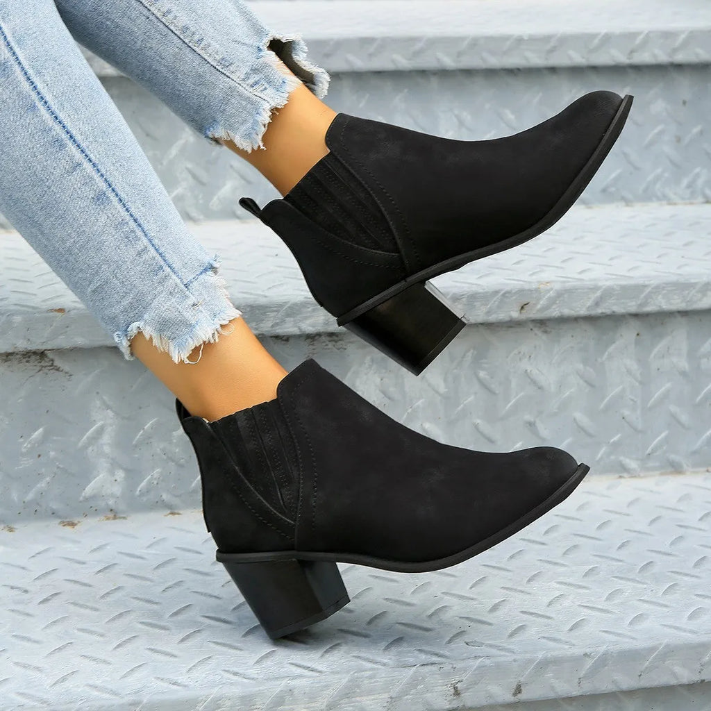 Women's black ankle boots with pointed toe and thick square heel design for autumn winter wear