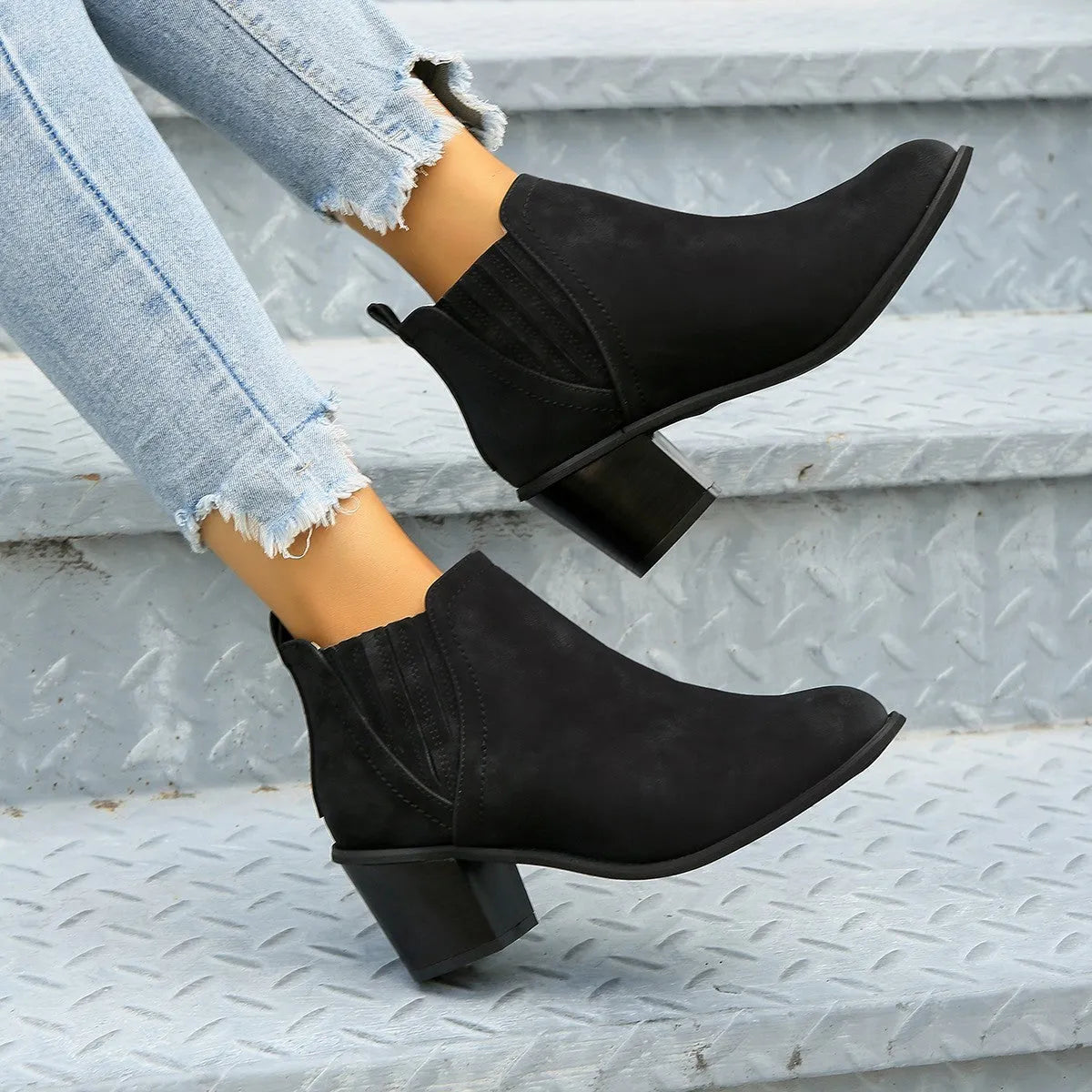 Women's black ankle boots with pointed toe and thick square heel design for autumn winter wear