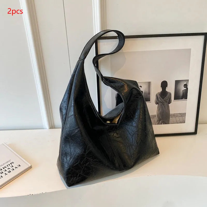 Soft PU leather shoulder bag with multiple external sandwich pockets in street-style design