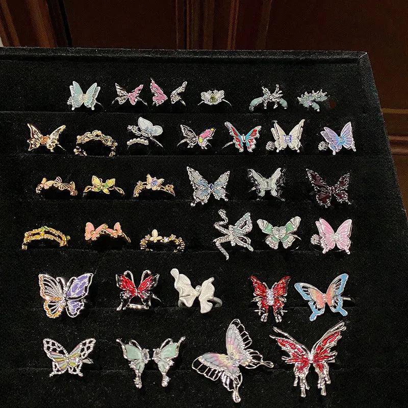 Women's butterfly design ring made from copper with an oil-drip finish, showing one of 33 colour variants.