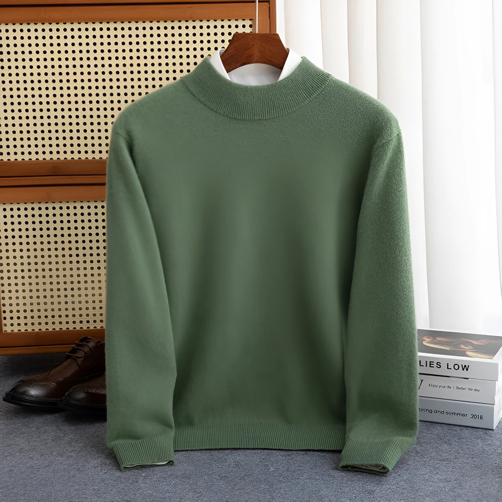 Man wearing a chunky knit half-turtleneck wool sweater in a loose fit.