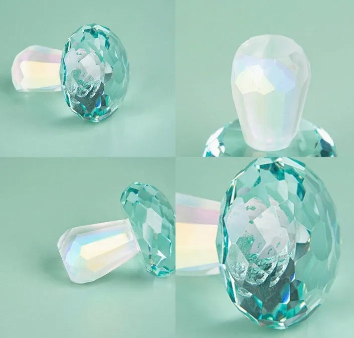 Colourful geometric crystal mushroom decoration in transparent, green, red, or yellow on a white background.