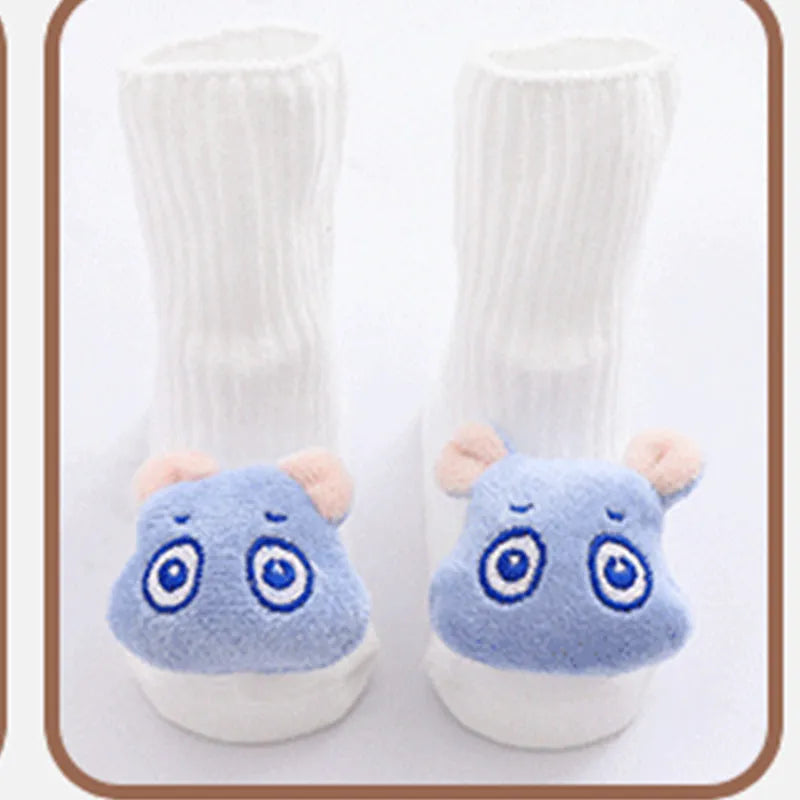 Cotton baby floor socks with non-slip soles in a pink bow print design.