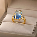 18K gold plated copper open mouth ring with synthetic zircon love emerald motif on white background