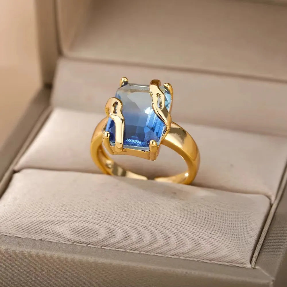 18K gold plated copper open mouth ring with synthetic zircon love emerald motif on white background