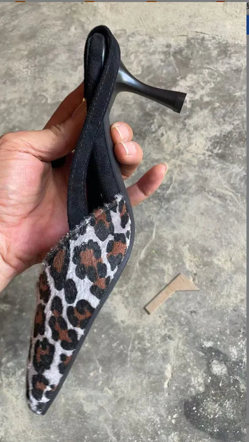 Leopard print suede women's sandals with a scattered pointed toe and high heel.